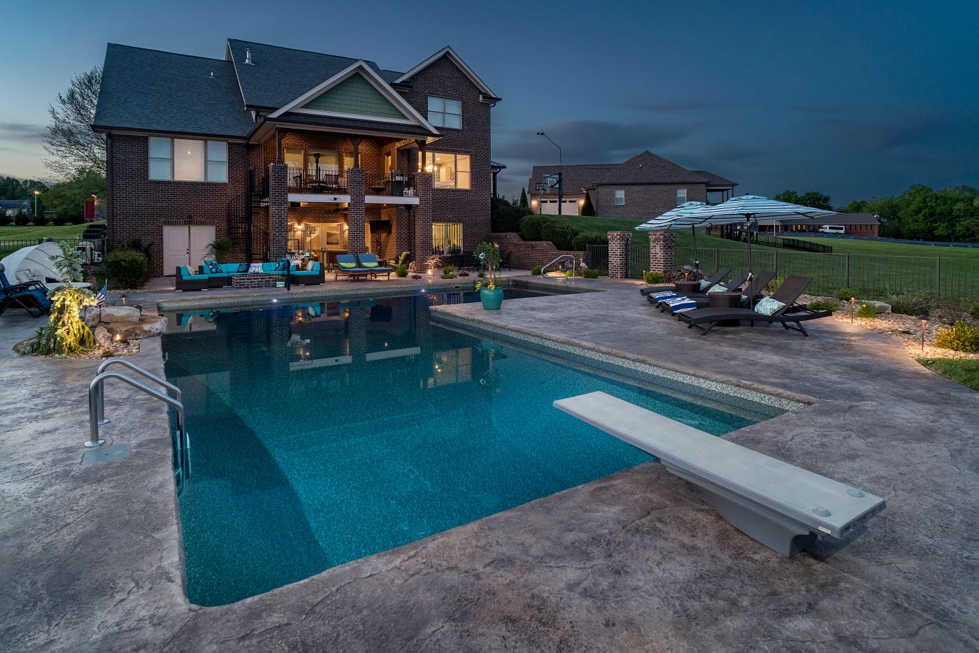 large vinyl liner pool in backyard with diving board