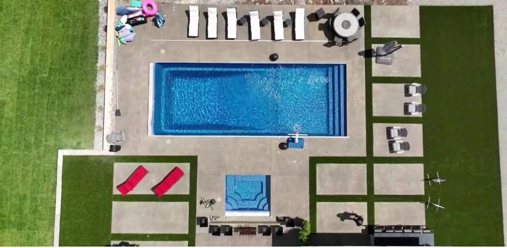 large fiberglass pool with spa in Washington backyard