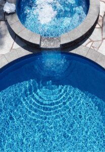 Overview of spa overflowing into inground pool