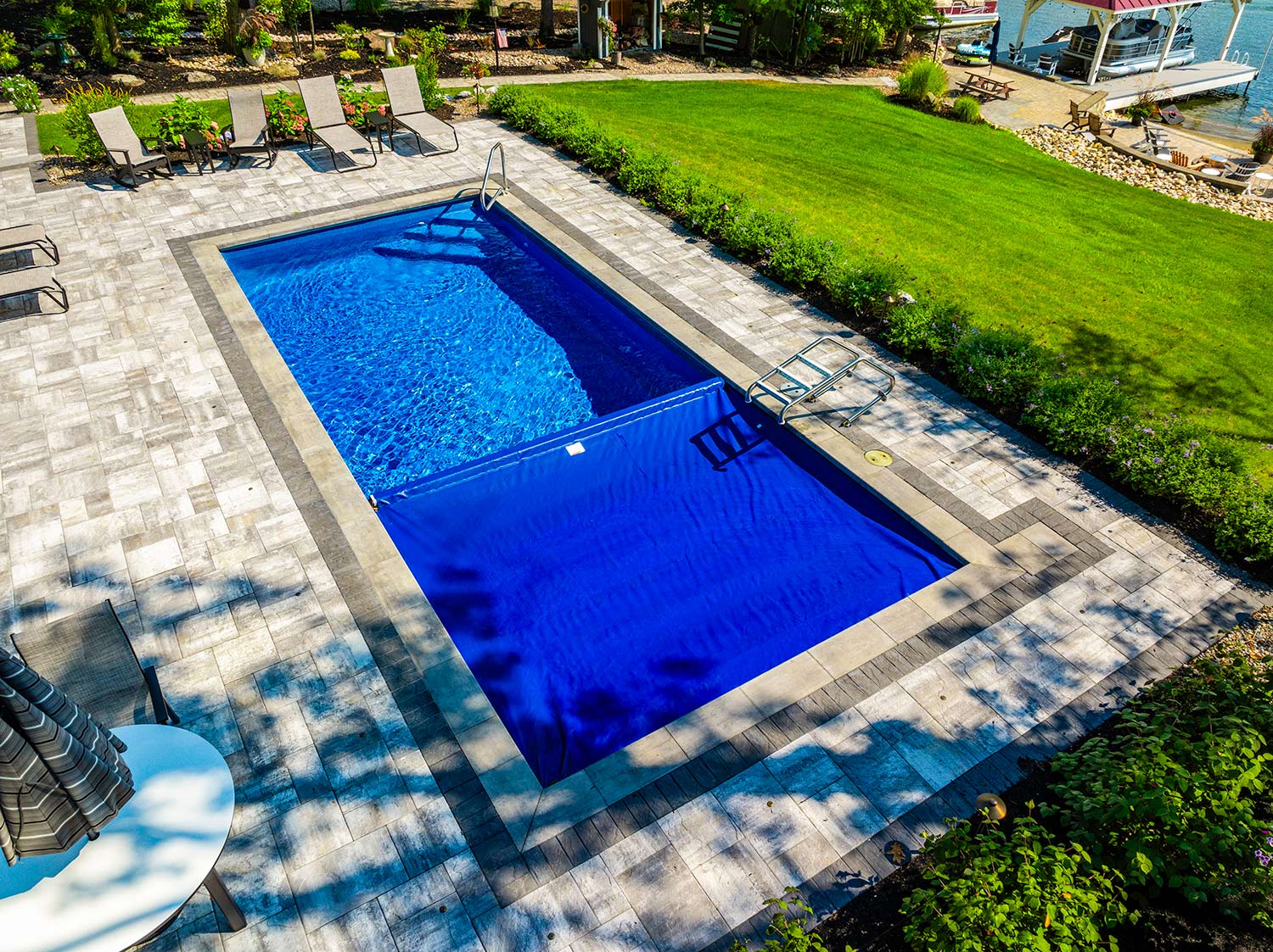 Latham Fiberglass pool and Coverstar Autocover | Photo courtesy of Concord Pools & Spas, NY